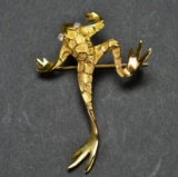 ITEM 33: FROG BROOCH IN A RAISED SCALE TYPE FINISH