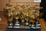 Lot of (12) Brass Base, Plastic Top Karting Trophies.