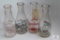 Four WV antique decorated quart glass milk bottles