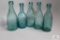 Five semi squat Blue glass Pennsylvania soda bottles