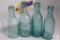 Four semi squat blue glass Pennsylvania soda bottles