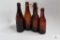 Four amber Ohio crown top beer bottles