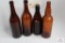 Four amber quart beer bottles including Ohio