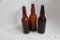 Three West Virginia amber quart beer bottles