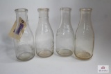 Four Clear WV quart glass milk bottles