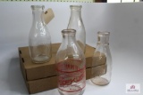 Four, quart WV milk bottles 3 clear, 1 decorated