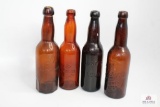 Four amber glass brewery bottles including Ohio & PA