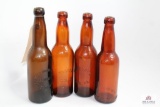 Four amber glass brewery bottles including Ohio, PA, & KY