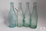 Four squat clear soda bottles including NJ, VA, NY, Ill