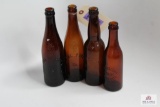 Four amber Ohio crown top beer bottles