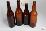 Four amber quart beer bottles including Ohio