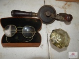 Glasses, hand drill, doorknob
