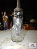 Marquette Manufacturing Co. glass oil bottle with cap