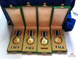 FOUR DESERT STORM SERVICE MEDALS (GOLD ACCENTS)