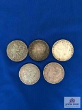FIVE MORGAN SILVER DOLLARS: 1879, 1884, 1887, 1896, 1921