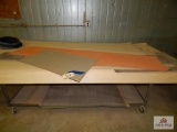 Rolling shop table with veneer sheets