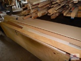 One rolling cart of various hard and soft woods