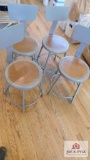 4 small metal chairs