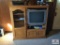 TV cabinet with Sony TV, Magazine, DVD player, and VHS tapes