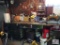 Lot on workbench left: Motor oils, antifreeze, jack, tool kit, buckets, garbage cans, water hose,
