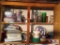 Contents of cabinet: Tupperware, blender, glass, vases, party items, etc.