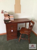 Wood desk with chair and books