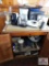 Contents of cabinet - coffee maker, mixer, hot plate, iron
