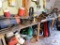 Contents of bench and wall - fishing equipment, anchors, car parts, yard lights, speed spreader