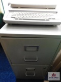 Filing cabinet and electric type writer