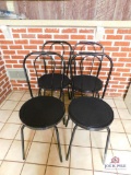 4 black metal chairs