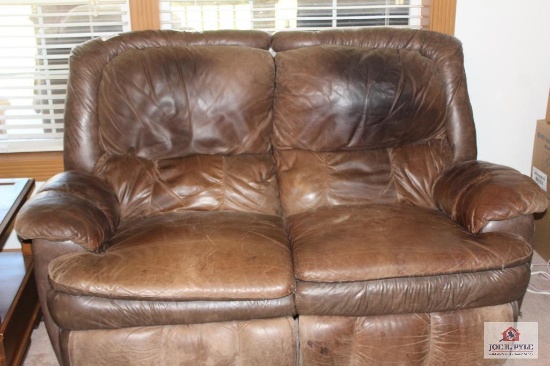 Brown leather love seat that reclines