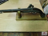 Decorative gun model on stand