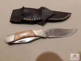 Folding knife with Damascus blade and leather sheath