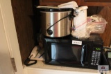 Microwave/can opener/mixer/crock pot