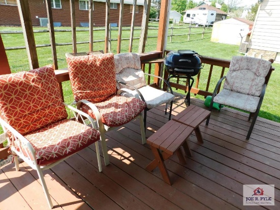 Chairs, charcoal grill and wood stools