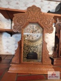 Antique oak ornate kitchen clock w/ gold decorated glass