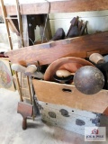 Trunk with an assortment of wooden pieces - rug beaters, bowls, shoe stretchers