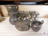 Pewter pitchers, cream and sugar and bowl with lid