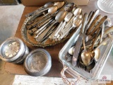 Large group of silverware and coasters