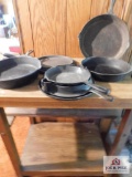 Rolling cart with cast iron skillets