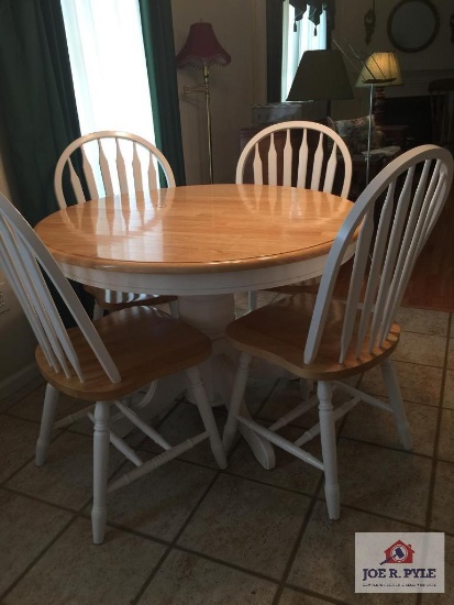 Round wood table with four (4) chairs and leaf