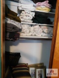 Contents of closet - afgans, sheets, blankets and pictures