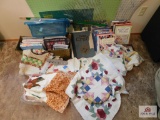 quilting books, cutting mats, quilt pieces