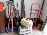 Group of snow shovels, brooms, axe, sledgehammer, pet keepers and dolly