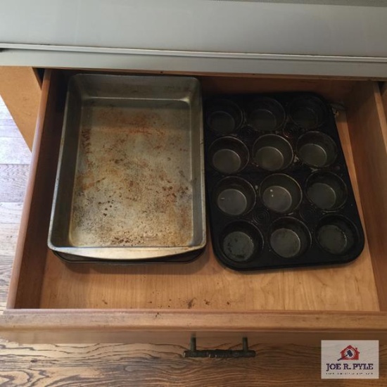 Contents of lower kitchen cabinets & drawers: pots & pans, bake ware, silverware, etc.