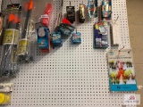 LARGE LOT OF ICE FISHING SUPPLIES INCLUDE: SKIP UPS, POPPERS, ETC