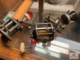 2 PENN BAIT CASTING REELS AND 2 OTHER TROLLING REELS