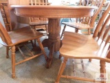 Pedestal oak table w/4 chairs & leaf