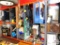 shelf and contents: battery charger, oils, electric cords, blades, etc.