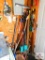 group of brooms, walking sticks, canes, small flag holders, and spotlight